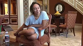 Curly amateur gives a footjob