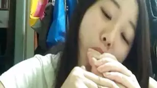 Japanese girl takes the time to suck on her sexy feet