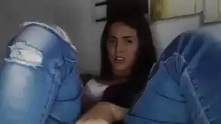 Brunette teen in jeans masturbates